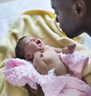 dad with infant