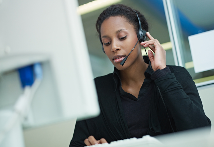 staff member on the phone at computer